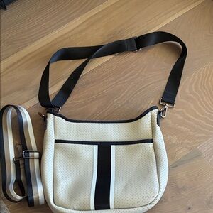 Haute Shore cream and black crossbody bag